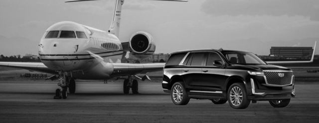 Black luxury SUV beside a private jet on the tarmac